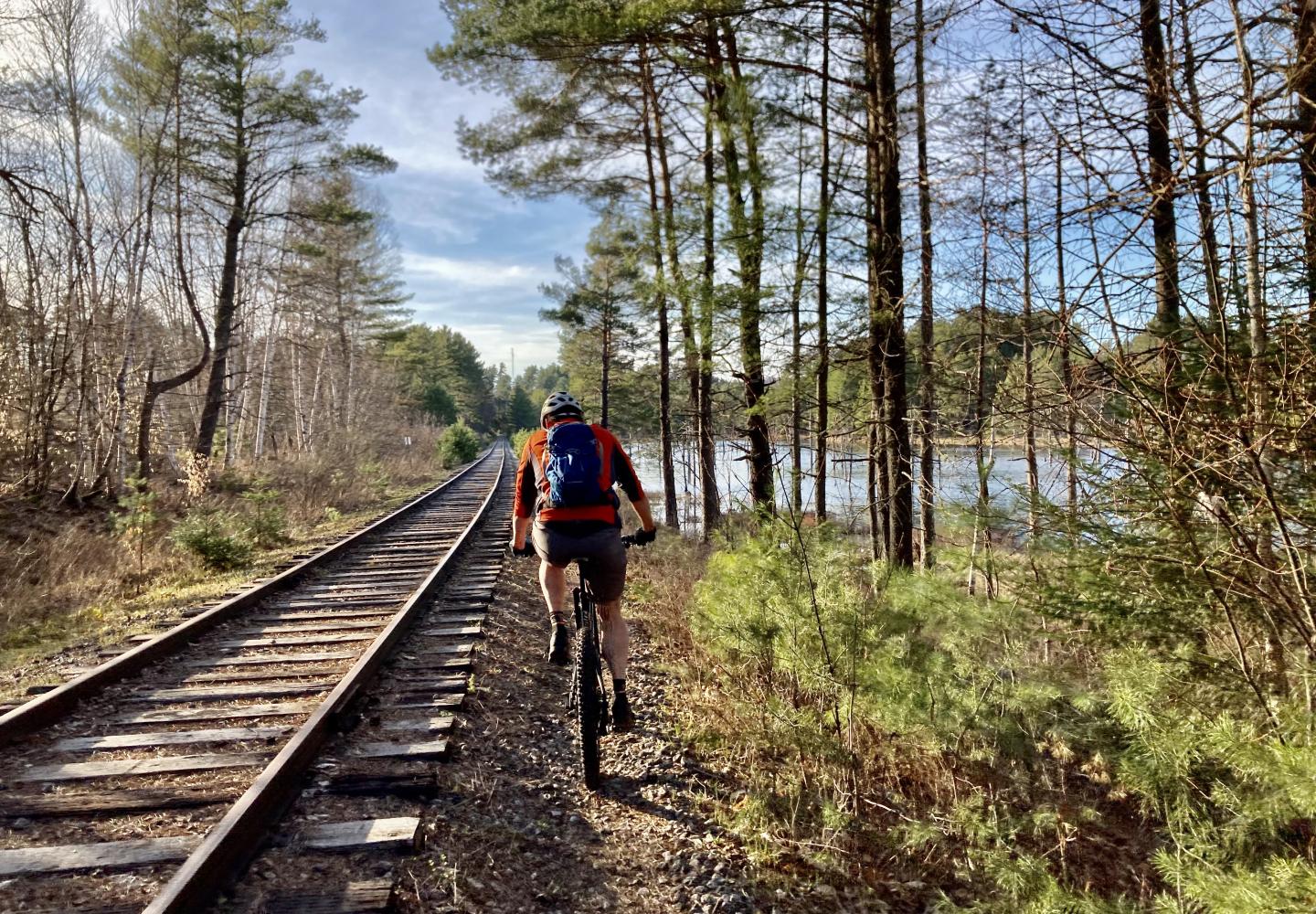 A rider pedals along the Adirondack Rail Trail before construction began.