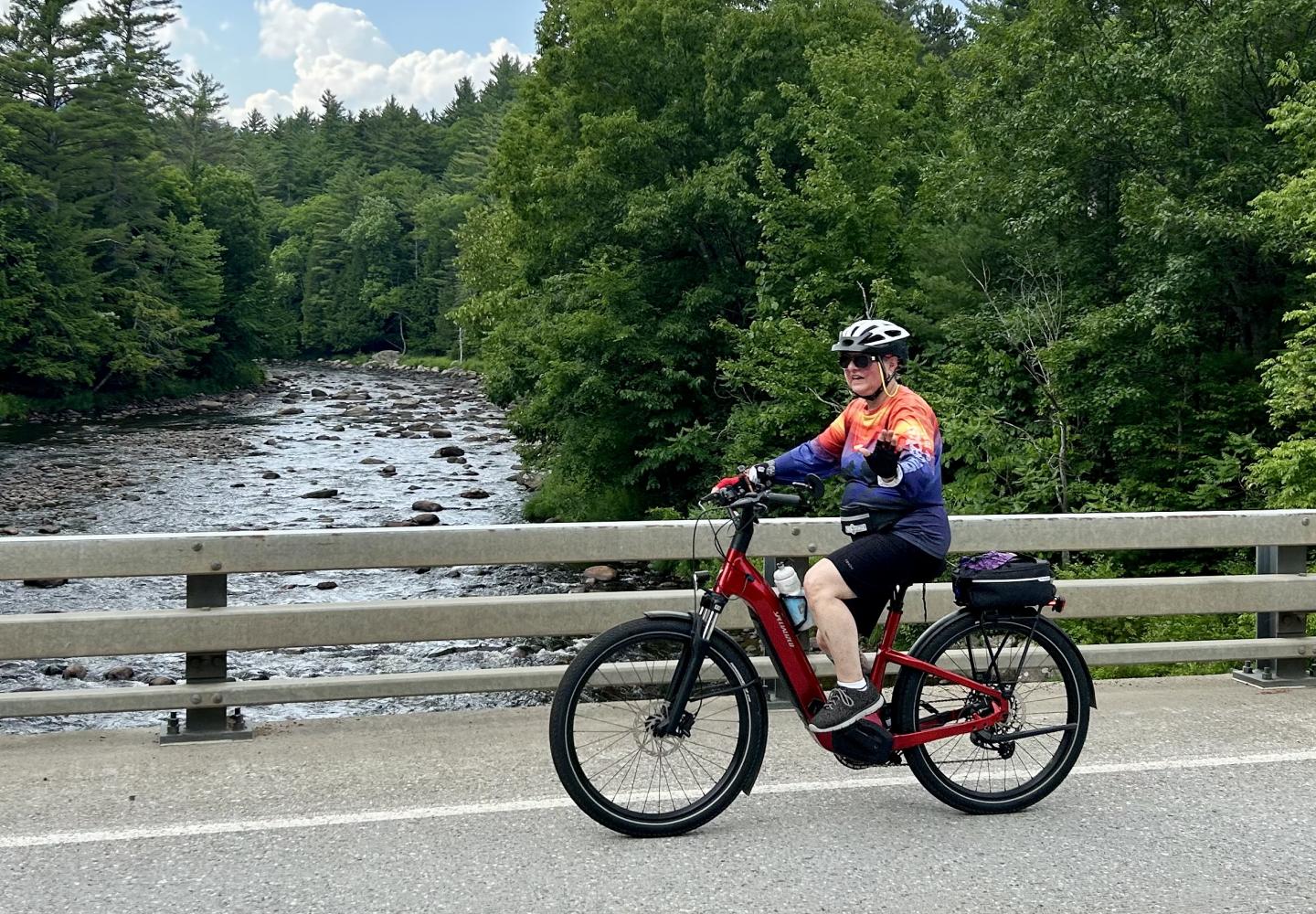 A cyclist enjoys Ride for the River on an e-bike.