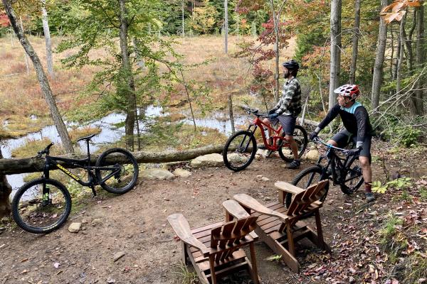 Riders check out the views at McCauley Mountain during Adirondack Mountain Bike Fest in Old Forge