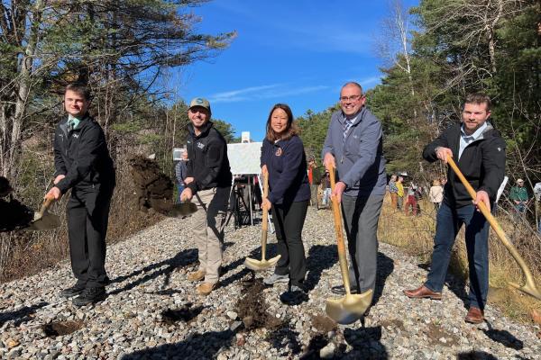 State officials came to Saranac Lake this week to open construction of the Adirondack Rail Trail. From left to right are Joe Zalewski, regional director of the Department of Environmental Conservation; Basil Seggos, environmental conservation commissioner; Jeanette Moy, Office of General Services commissioner; Steve Gagnon, a design engineer for the Department of Transportation; and Saranac Lake Mayor Jimmy Williams. Photo courtesy of NYSDEC.