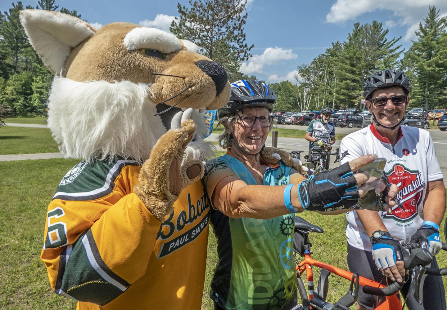 Weekender at Paul Smith's College guests take a selfie with the college mascot.