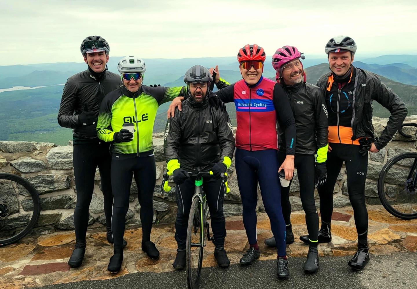 Members of the Verrazano Cycling Club celebrate a successful ADK Unite at the summit of Whiteface Mountain.