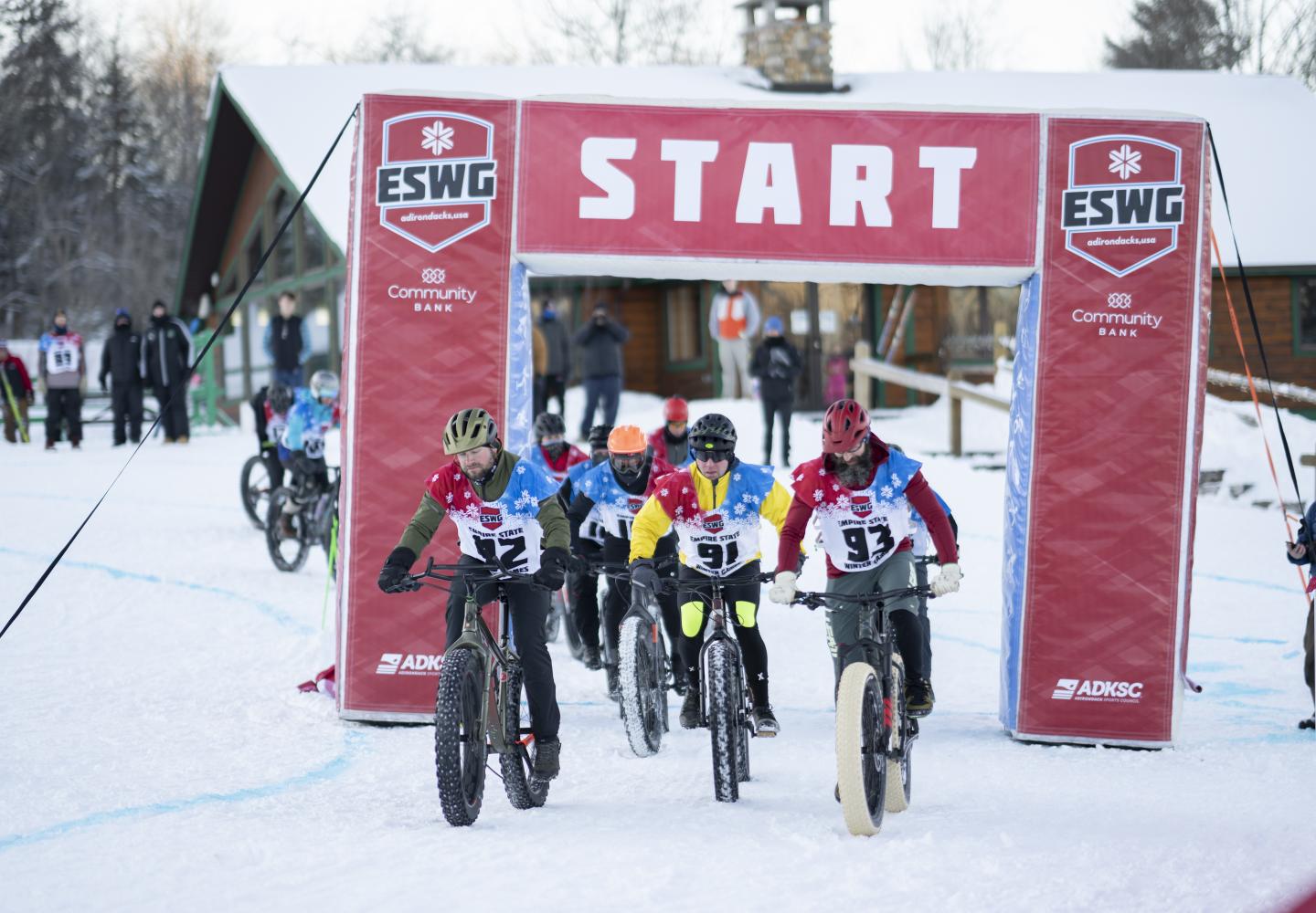 Bicyclists take off from the starting line during the Empire State Winter Games Cross-Country Biking 5K race at Mt. Pisgah on Saturday, February 5, 2022. (Photo by Kayla Breen/Newhouse School)