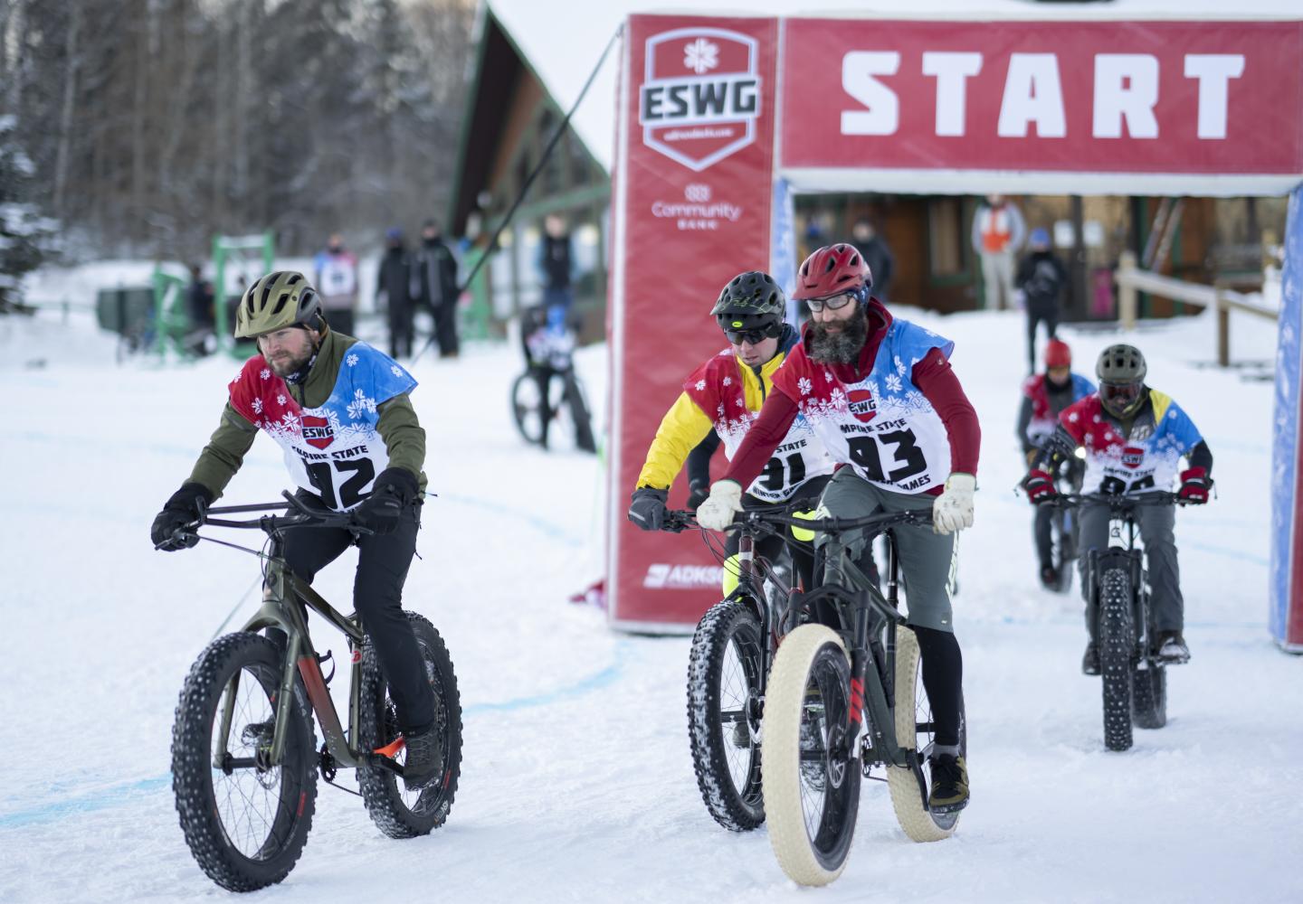 Bicyclists take off from the starting line during the Empire State Winter Games Cross-Country Biking 5K race at Mt Pisgah on Saturday, February 5, 2022. (Photo by Kayla Breen/Newhouse School)