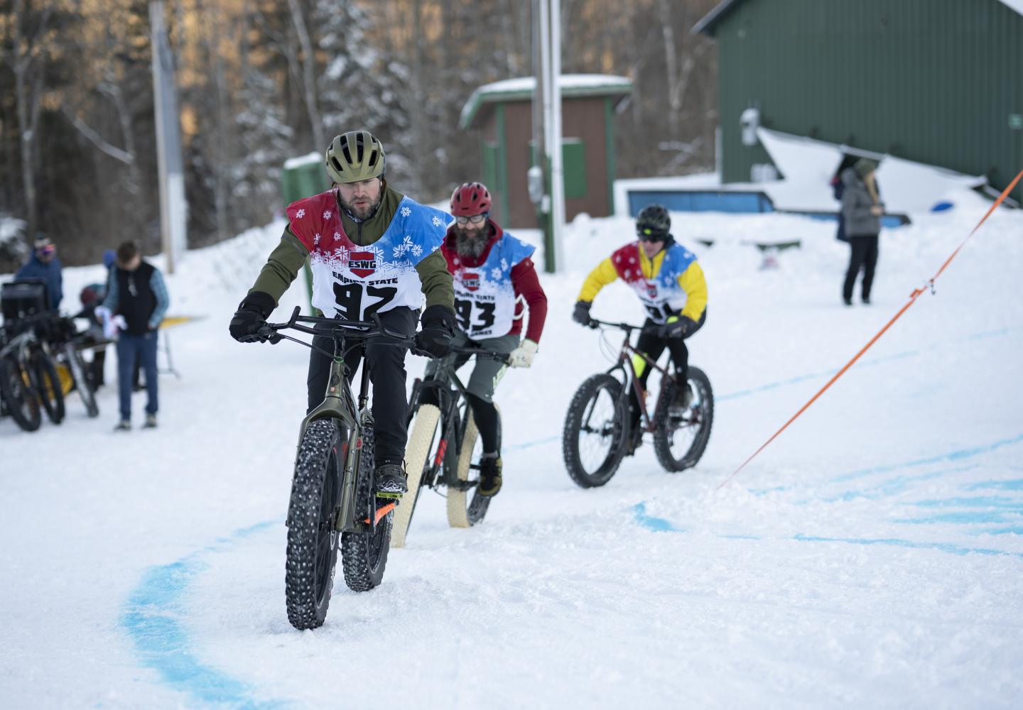 Bicyclists round a corner during the Empire State Winter Games Cross-Country Biking 5K race at Mt. Pisgah on Saturday, February 5, 2022. (Photo by Kayla Breen/Newhouse School)