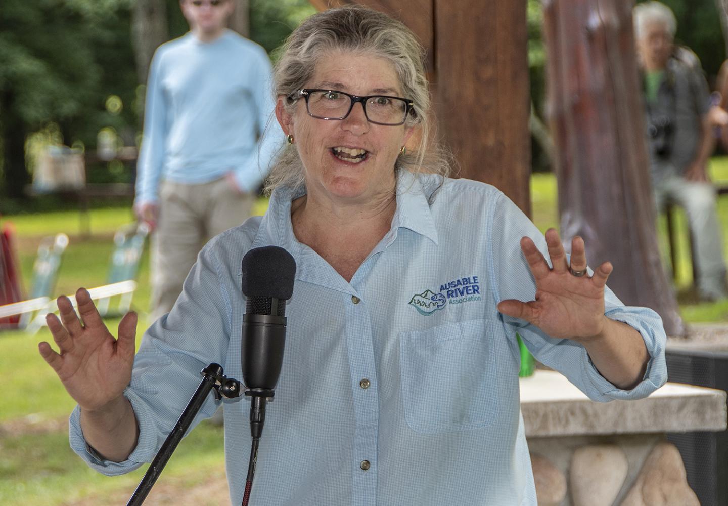 Ausable River Association Executive Director Kelley Tucker thanks riders. 