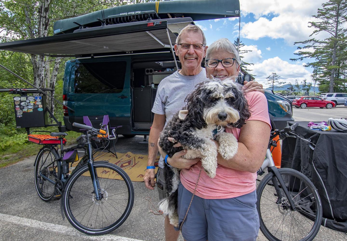 August 2022: Guests of the 2022 Weekender at Paul Smith's College pose with their RV, canoe and puppy.