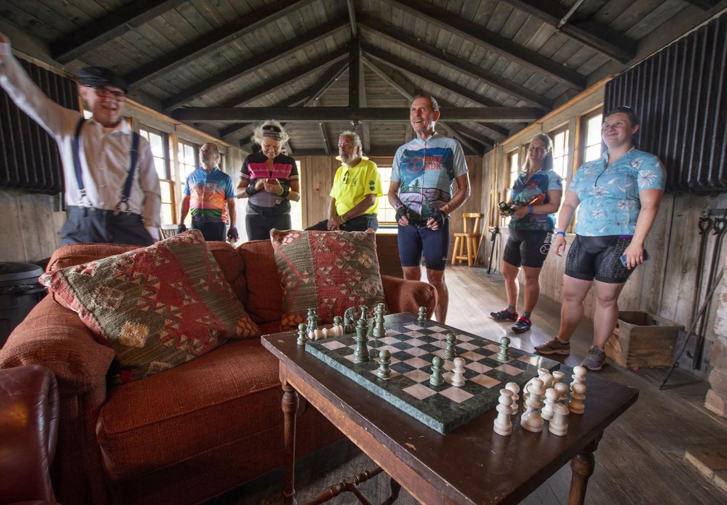 A group of riders takes a guided tour of historic White Pine Camp.