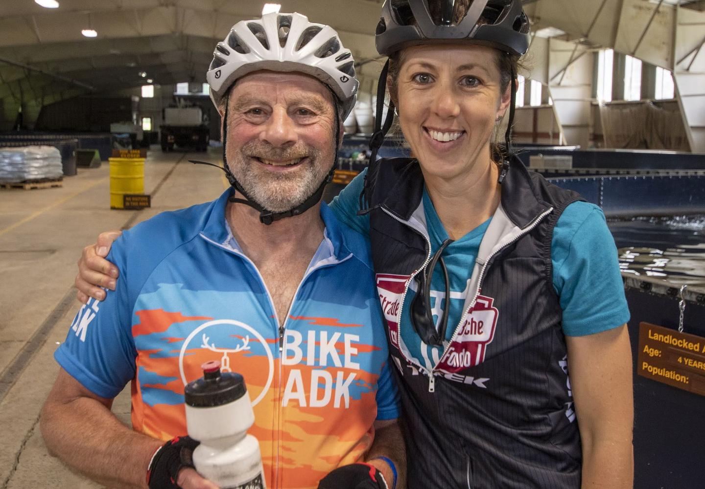 BikeADK ride marshals Jim and Julianne enjoying the Sunday morning stop at the Lake Clear Fish Hatchery.