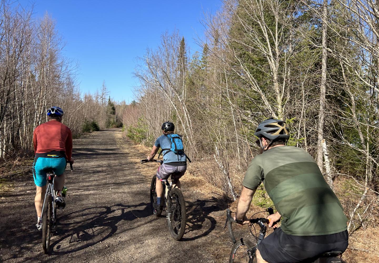 May 2023 - A group of cyclists enjoys an unfinished section of the Adirondack Rail Trail between Saranac Lake and Lake Clear.