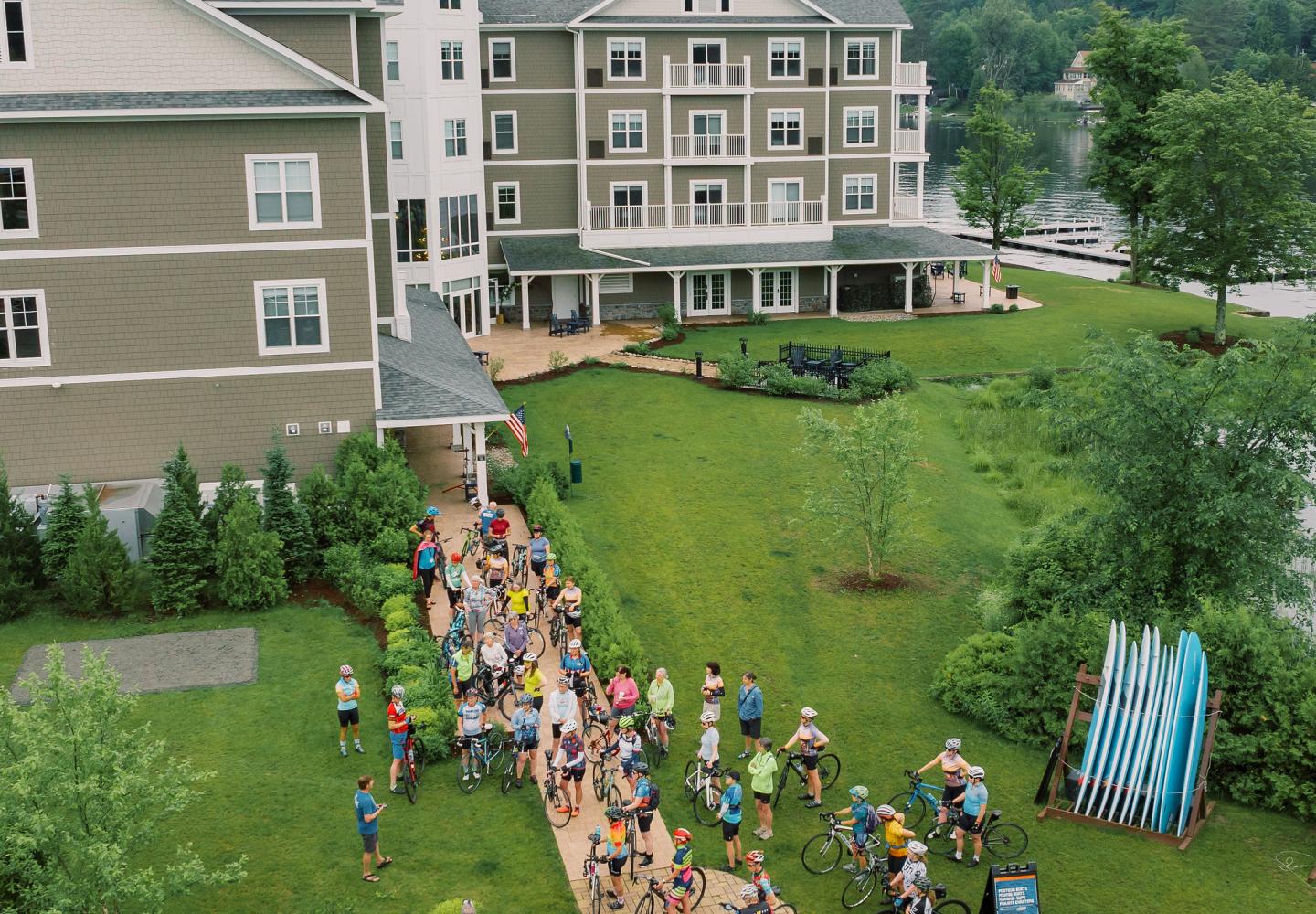 Riders gather outside the Saranac Waterfront Lodge for dry day or pedaling the park. 