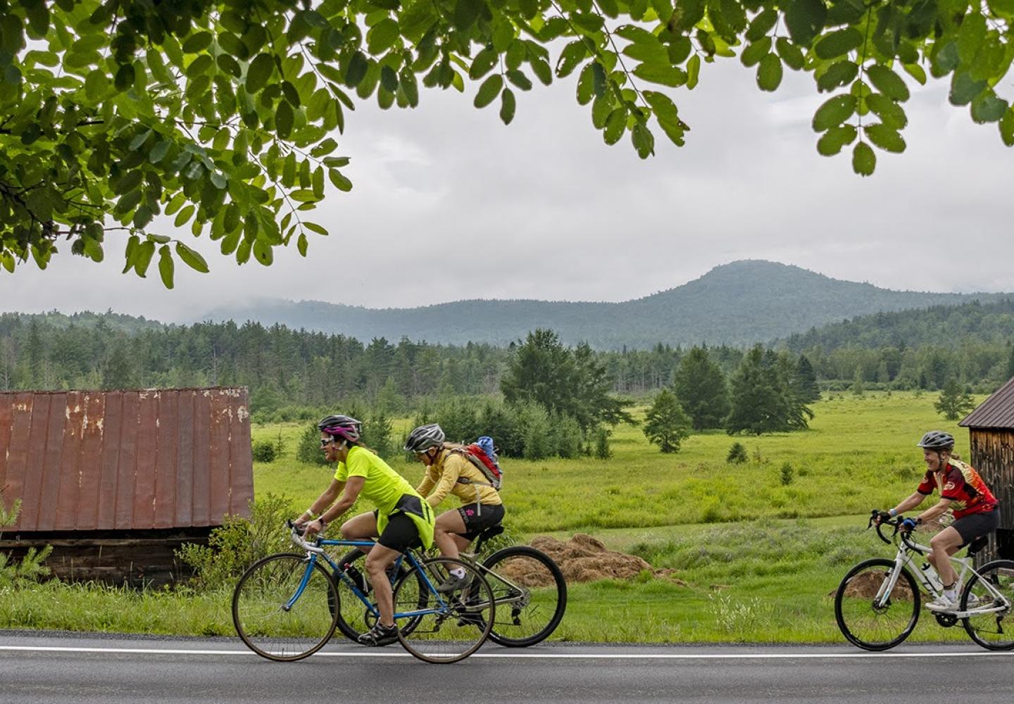 Cyclist explore the pastoral landscape in the Ausable River valley.