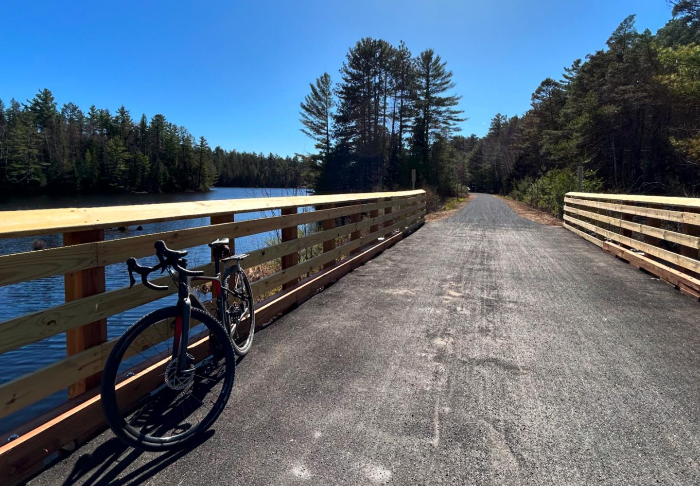 A bridge crossing over Ray Brook on Phase 1 of the Adirondack Rail Trail.