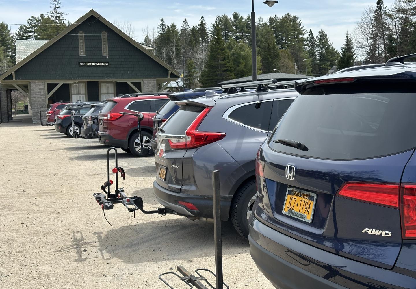 Vehicles pack the Lake Placid Depot lot where the Open Space Institute will be constructing a new Adirondack Rail Trail hub. 