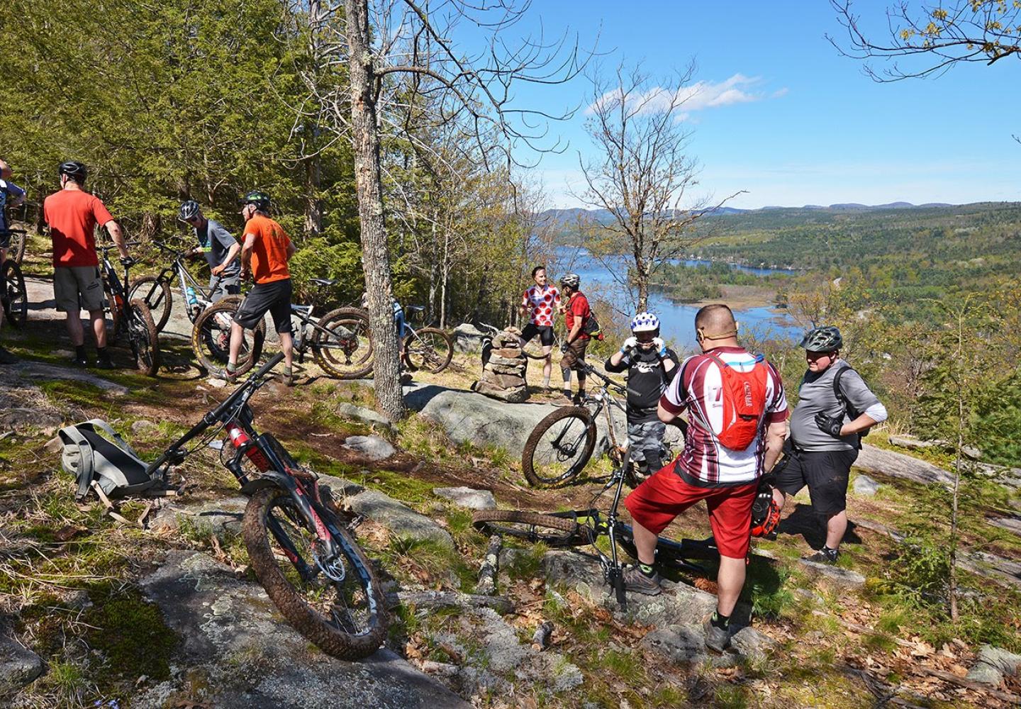 Riders take in the view at the top of the Brant Lake Bike Park