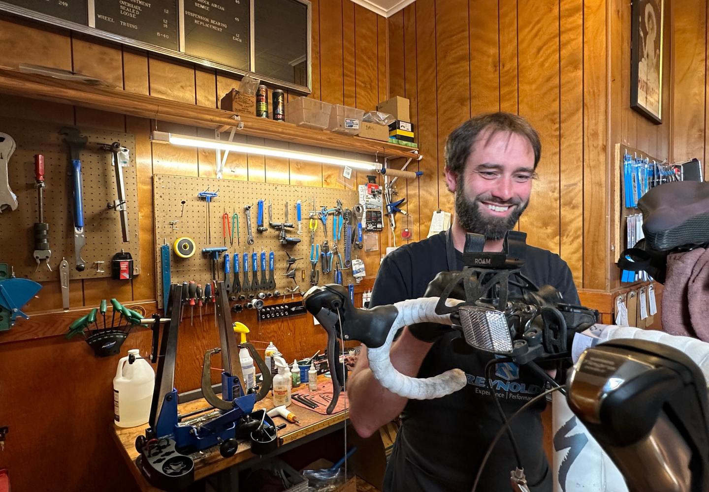 The Hub Owner Drew Cappabianca works on a bicycle in the bike shop.