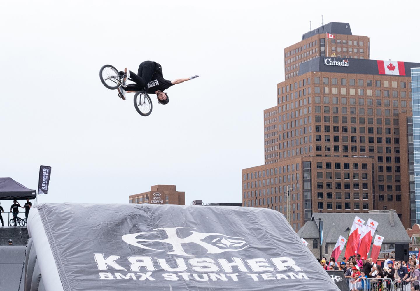 A member of the Krusher BMX team soars off a jump and onto an airbag during a recent show. 