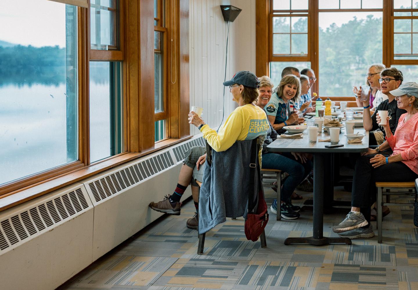 Riders enjoy breakfast and the view of Lower St. Regis Lake during the Weekender.