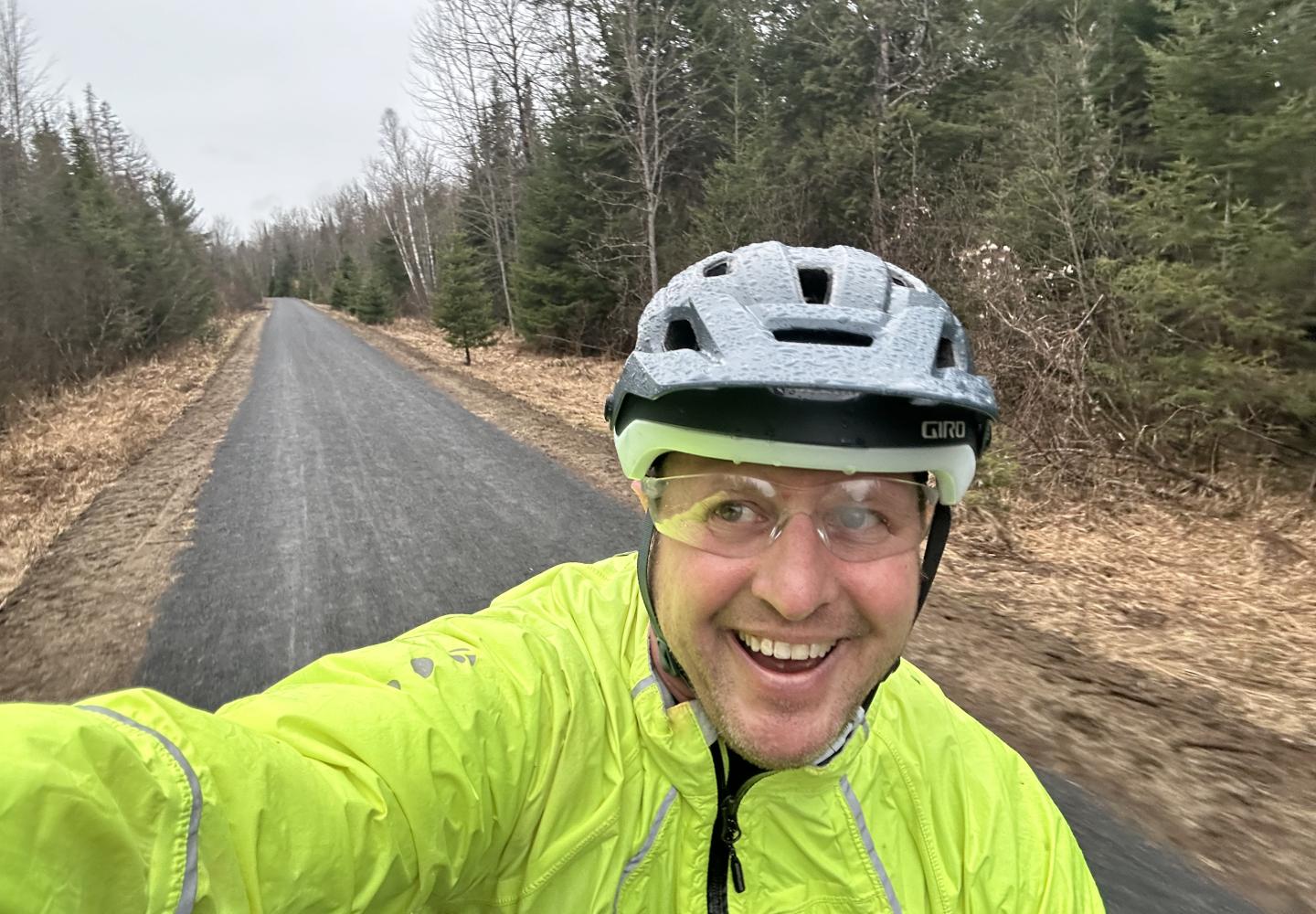 The author enjoying a wet morning ride on the Adirondack Rail Trail.