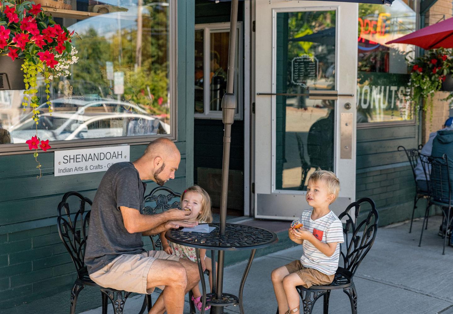 A family enjoys doughnuts at the Washboard Doughnut Shop and Laundromat in Tupper Lake, NY