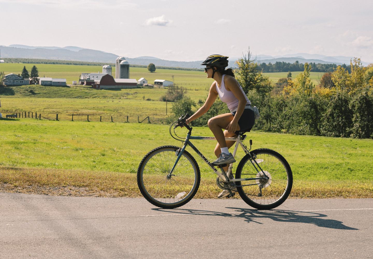 A bicyclist enjoys the rich farm views during the annual Bike the Barns.