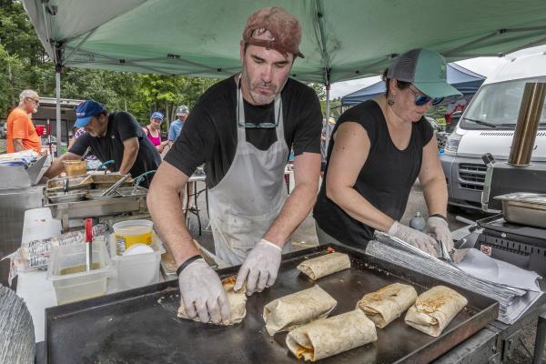 Grilling up fresh burritos on site.